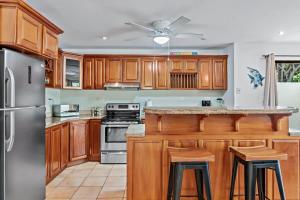 Inviting Home with Colorful Decor and Private Backyard Oasis with a Swimming Pool & Shaded Terrace