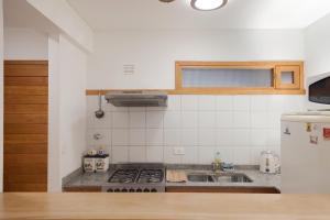 Depto Centrico con pequeño jardin y parrilla