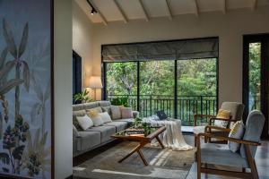 SaffronStays Arabella - 4BR bohemian pool villa with sunken lounge, foosball, PS4 & mango orchard views in Alibaug