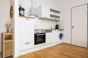 mayhome - das STRANDLOFT schönes Studioapartment mit Balkon, Küche und Tiefgarage - Sauna und Fitness direkt nebenan