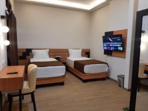 Phòng Hai Giường Đơn Loại Sang (Deluxe Twin Room)