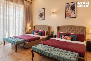 StayVistas Sianna Villa - Near Kihim Beach with Kitchen Garden & Recreational Facilities