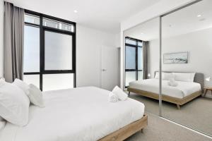 Elegant coastal living near shops and surf beach