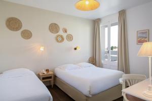 Hotels Hotel De La Plage : photos des chambres