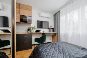 Modern Black & Wooden Apartment Warsaw Near The Airport by Renters