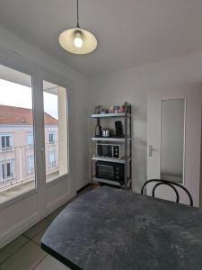 Appartements The place to be, parking gratuit : photos des chambres