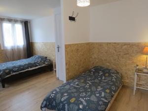 Maisons de vacances Le Gite du Coin - Maison de vacances avec jardin : photos des chambres