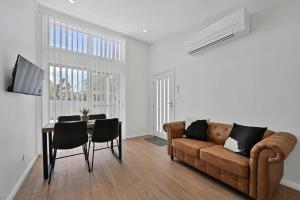 The Elm Apartments - The Cowhide Room