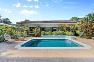Stylish Home with Chic Decor, Luxury Amenities & Tropical Outdoor Oasis with Sparkling Private Pool