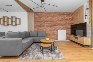 Elegant Apartments in Gdańsk with Sauna, Gym and Parking by Noclegi Renters