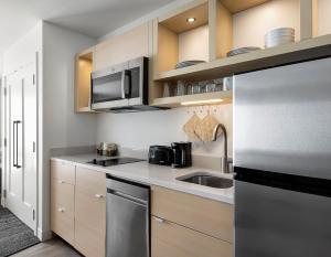 Queen Studio with Two Queen Beds and Sofa Bed room in TownePlace Suites by Marriott Iron Mountain