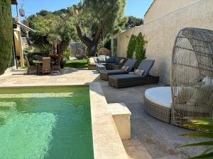 Appartements Logement cosy avec piscine ,parking et jardin : photos des chambres