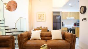 Spacious 2BR Masdar City Duplex - Urban Luxe Retreat