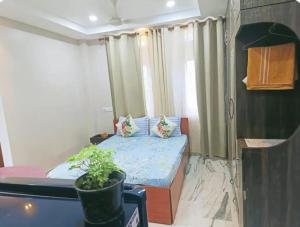 Riverside Palm 1BHK with AC and Terrace Access near Kamakhya temple