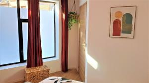 Appartements petit cocon lumineux - Clim : photos des chambres