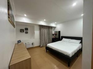 2BR Condo w free parking near SM North