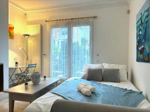 Appartements Color - Charmant appartement proche RER B & C avec Jardin : photos des chambres