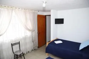 Habitación familiar central - La Cabaña