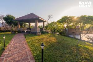 StayVistas Nyra Farms - Hill-view villa with Pool, Indoor & Outdoor games, & Lawn with Gazebo