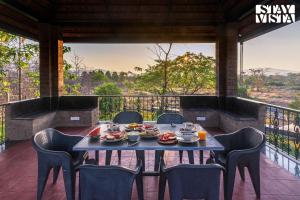 StayVistas Nyra Farms - Hill-view villa with Pool, Indoor & Outdoor games, & Lawn with Gazebo