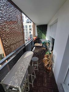 Appartements cosy appartement proche de la Defense : photos des chambres
