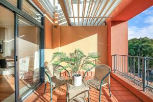 Two Adjacent King Suites with a Breezy Balcony