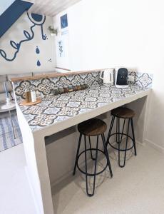 Appartements Les Alpes Grecques, studio avec terrasse : photos des chambres