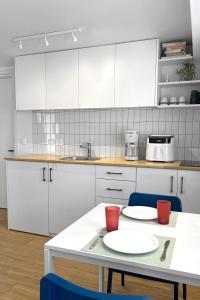 Minimalist Seaside Apartment with Private Patio and Parking - Blue Zone Homes