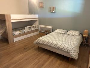 Appartements Au coeur des bois : photos des chambres