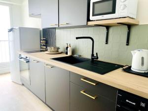 Le Cocon central - Wifi - Transports et Commerces