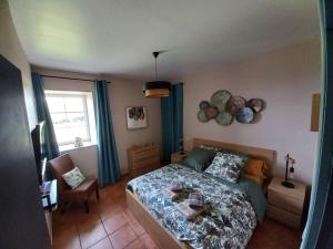 Maisons de vacances Au detour du Puy Maison avec piscine interieure a 15 mn Puy du Fou : photos des chambres