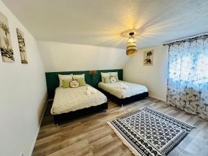 Maisons de vacances Maison Le M - Disneyland Parking : photos des chambres