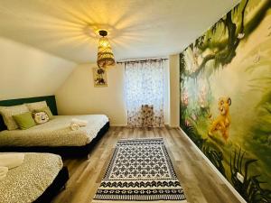Maisons de vacances Maison Le M - Disneyland Parking : photos des chambres