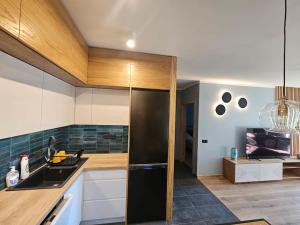 Apartament przy Loftach u Scheiblera parking podziemny, Śniadaniownia