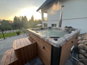 Domki i Apartamenty Wypoczynkowe z jacuzzi Lidzbark