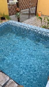 Casa ampla com piscina 4 quadras da praia , Espaço gourmet churrasqueira - ホステル, プライア・グランデ