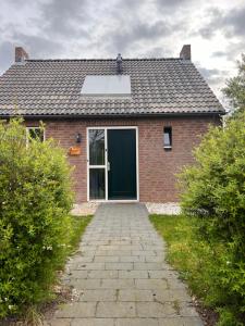 Vrijstaande 6 persoons Bungalow hottub en pizzaoven op vakantiepark