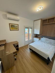 Face à la mer avec clim, wifi, parking