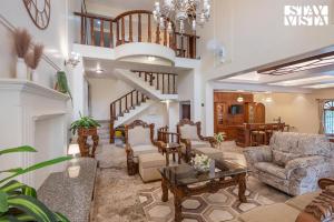 StayVistas Hillside Serenity - Hill-view villa with Outdoor pool, Bar, Spacious lawn, and Indoor & Outdoor activities
