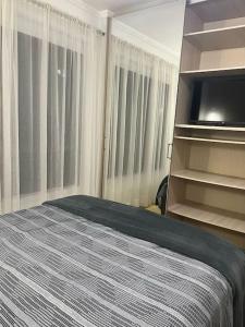 1 quadra da Praia e da Roda Gigante