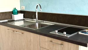 Palme 1C - Marcelli, monolocale con giardino, Residence Le Palme