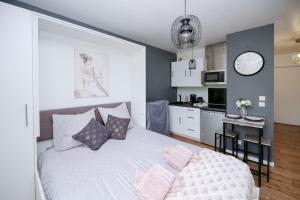 Appartements NeuvaRoom : photos des chambres