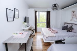 Appartements NeuvaRoom : photos des chambres