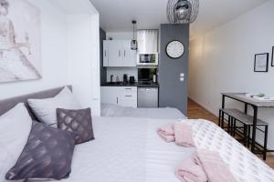 Appartements NeuvaRoom : photos des chambres