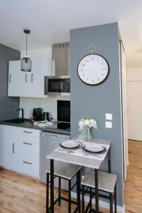 Appartements NeuvaRoom : photos des chambres