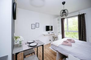 Appartements NeuvaRoom : photos des chambres