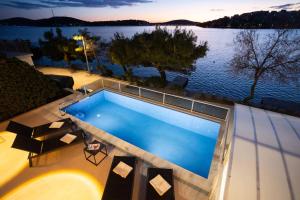 Villa Sea Touch - beachfront, with a heated pool