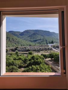 LAlmàssera - Chimenea y montaña para grupos en Aielo de Rugat