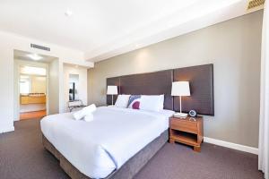 Towering Palms, A Seaside Balcony with Resort Pool