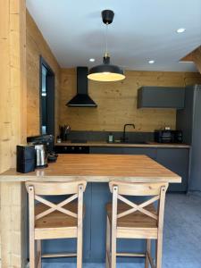 Les Chalets Perce Neige & Jacuzzi privatif, proximite Gerardmer & La Bresse : photos des chambres